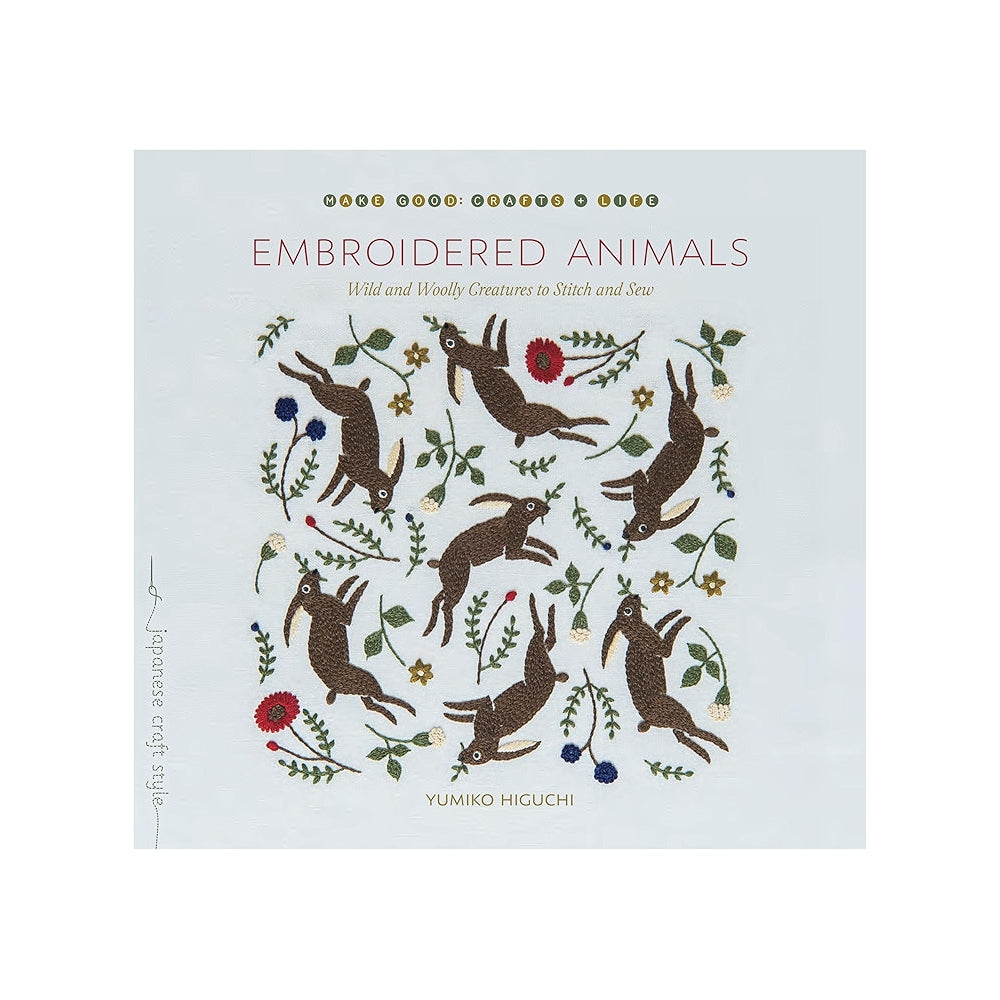 Book cover with embroidered animals design on a white background