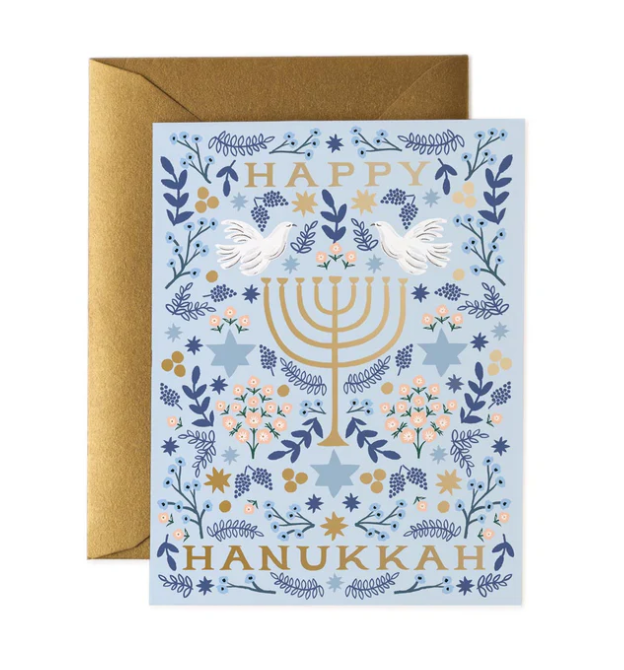 Hanukkah greeting card with Menorah, stars, and flowers on a blue background with gold and white accents.