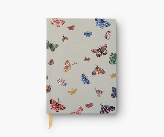Notebook with colorful butterfly pattern on a white background