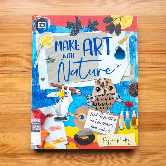 Book titled 'Make Art with Nature' on a wooden surface
