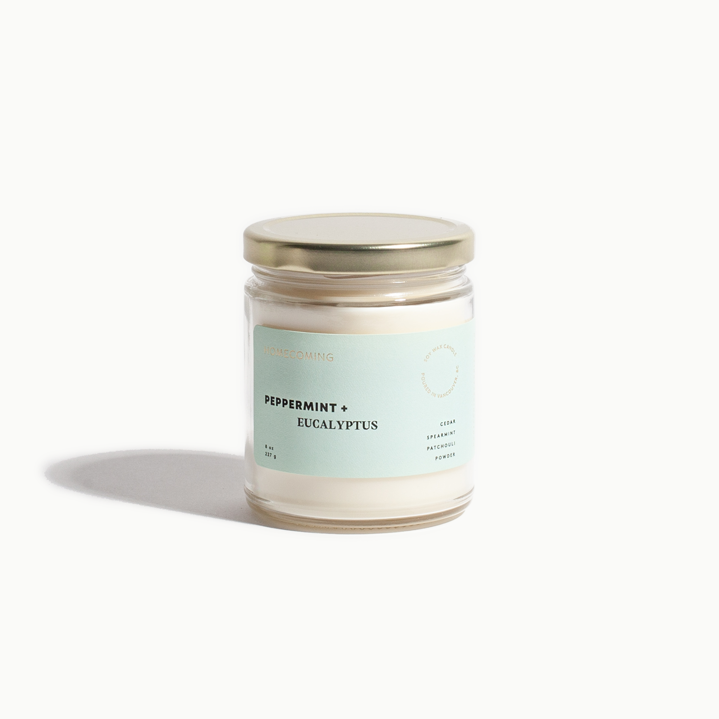 Candle jar with a label on a white background