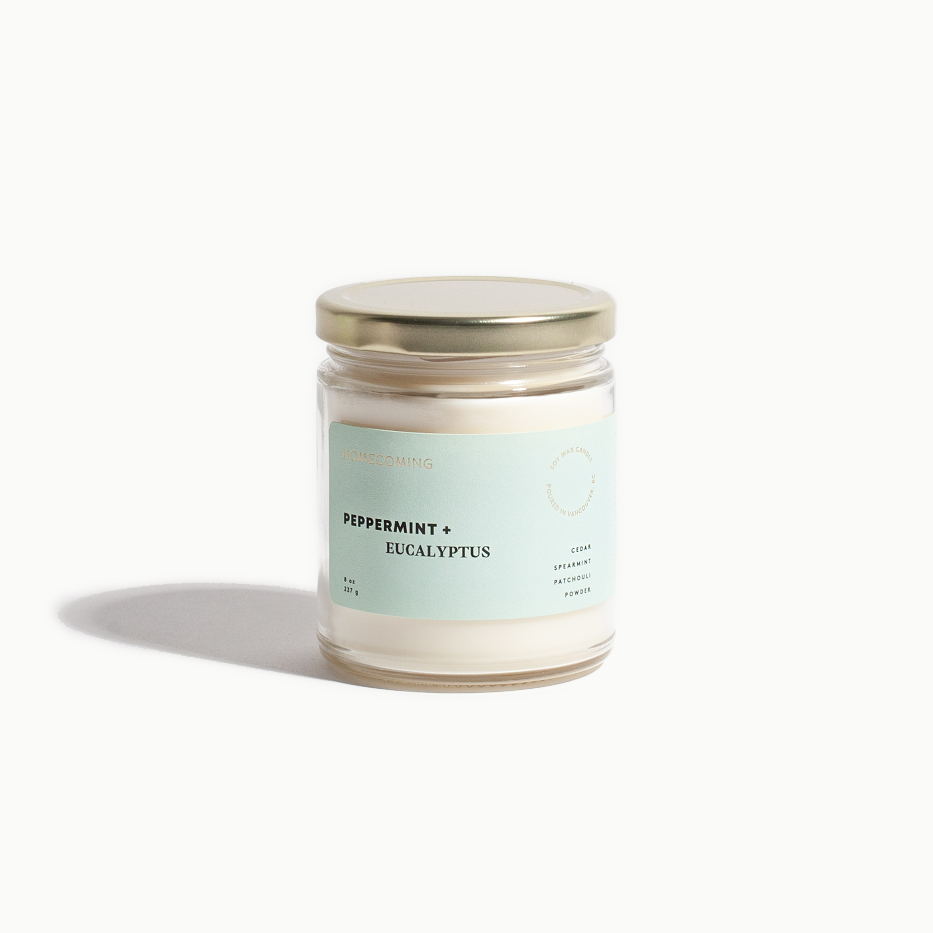 Candle jar with a label on a white background