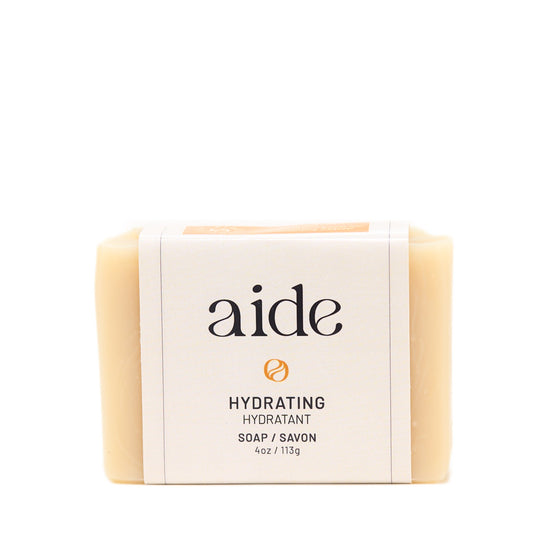 Bar of soap with 'aide' branding on a white background